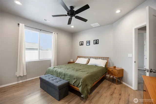 a living room with a bed furniture and a window