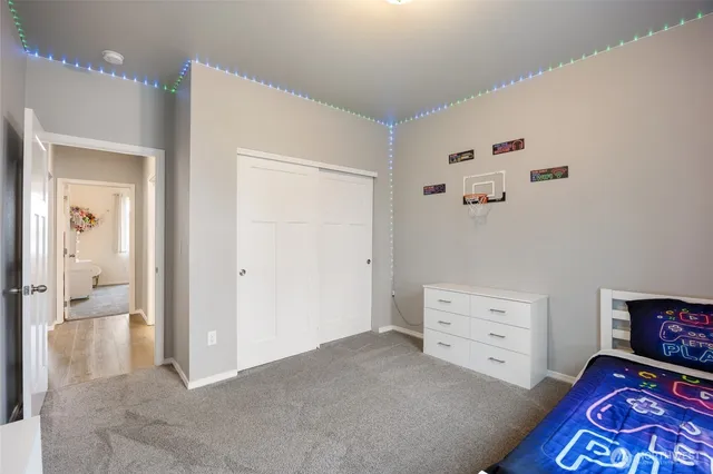 a view of room with cabinet and view of bedroom