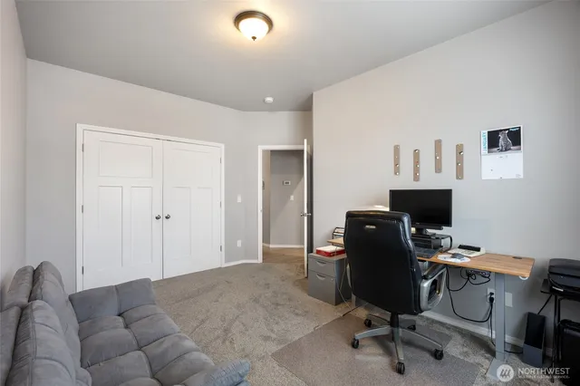 a view of a workspace with furniture