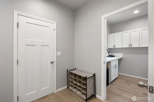 a view of cabinets and wooden floor
