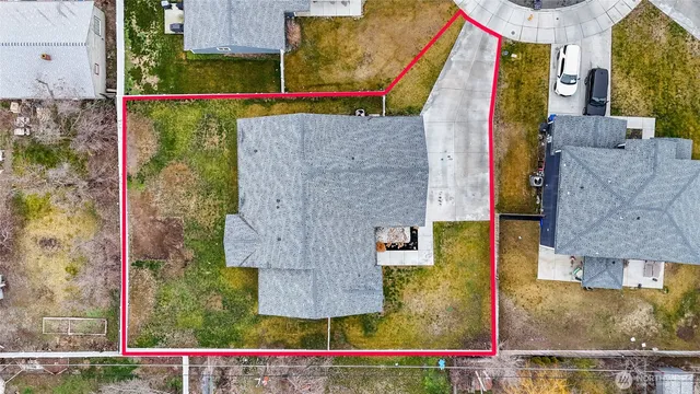 an aerial view of houses with outdoor space