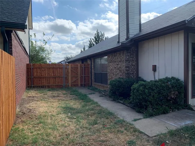 a backyard of a house with lots of green space
