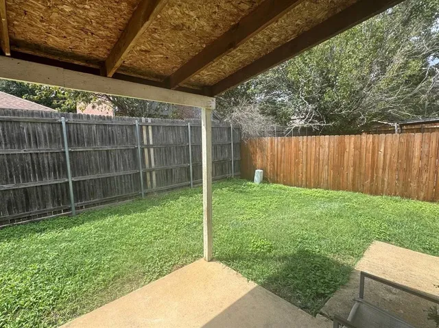 a view of a backyard with a garden