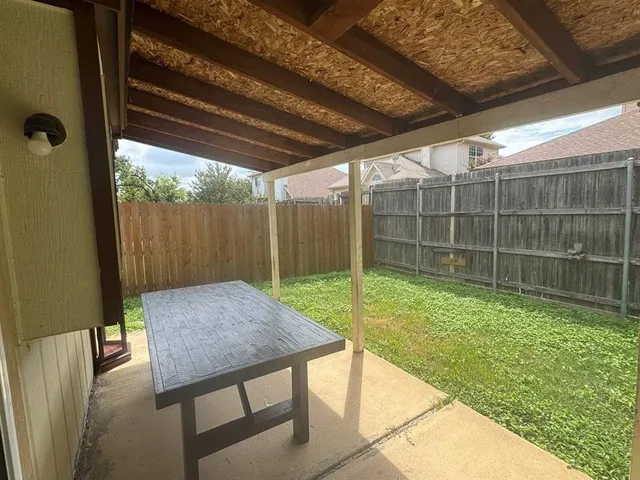 a view of backyard with tub