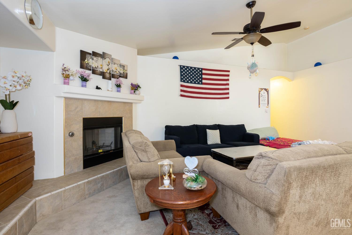 Undisclosed Address Bakersfield, CA 93313 - Photo 4 of 19 a living room with furniture and a fireplace