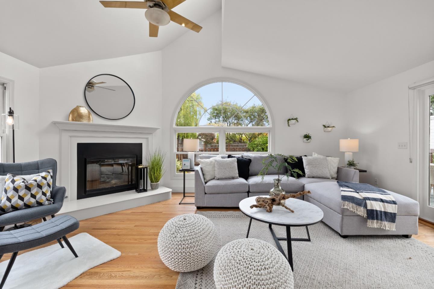 220 Channing Road Burlingame, CA 94010 - Photo 13 of 60 a living room with furniture a rug a fireplace and a large window