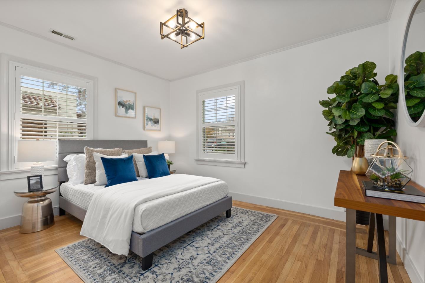 220 Channing Road Burlingame, CA 94010 - Photo 18 of 60 a bedroom with a large bed and a potted plant