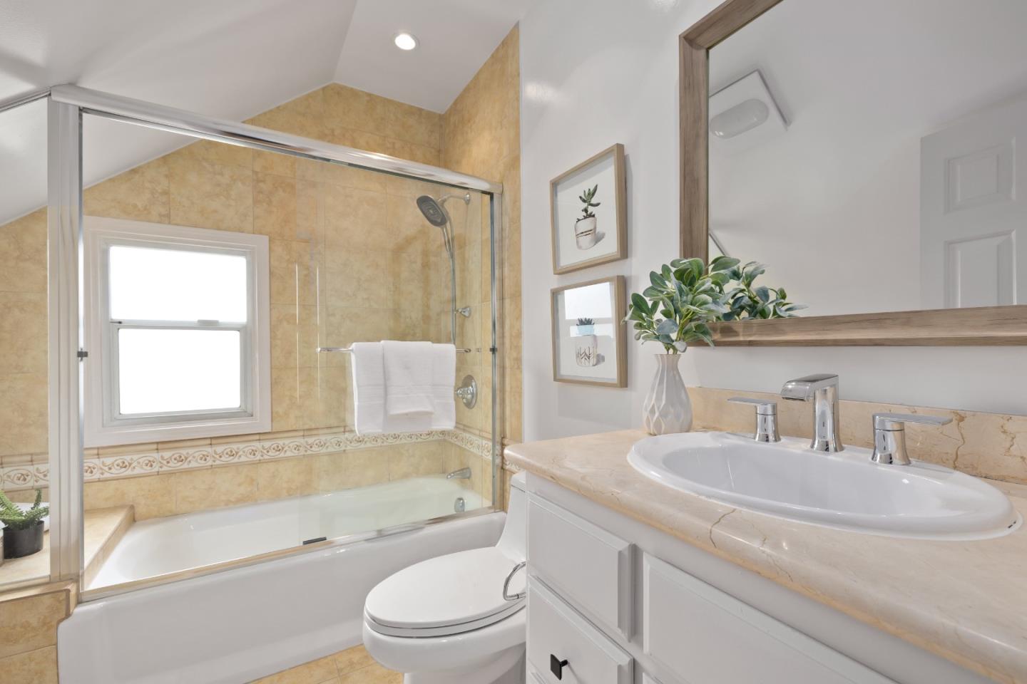 220 Channing Road Burlingame, CA 94010 - Photo 19 of 60 a bathroom with a granite countertop sink a toilet and shower