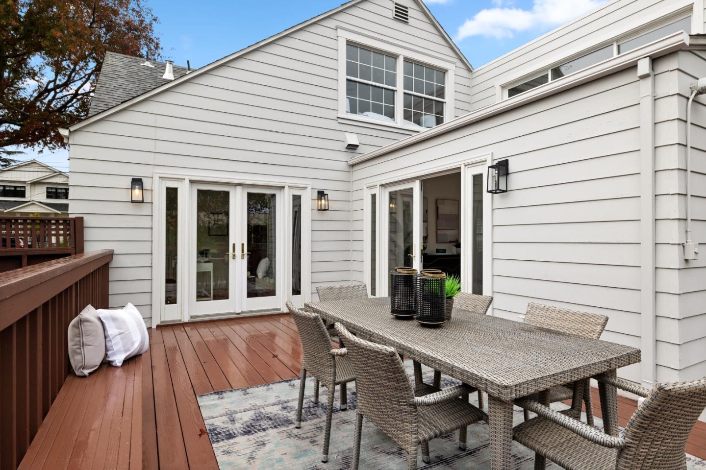 220 Channing Road Burlingame, CA 94010 - Photo 53 of 60 a view of a deck with table and chairs with wooden floor and fence