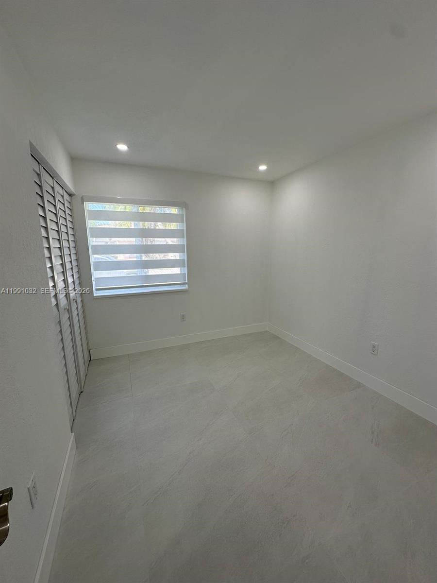 20926 Southwest 124th Ave Road Miami, FL 33177 - Photo 5 of 10 an empty room with a window
