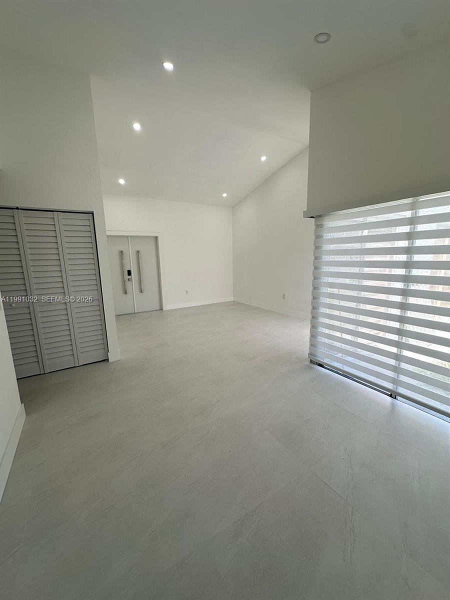 20926 Southwest 124th Ave Road Miami, FL 33177 - Photo 7 of 10 a view of a livingroom with an empty space
