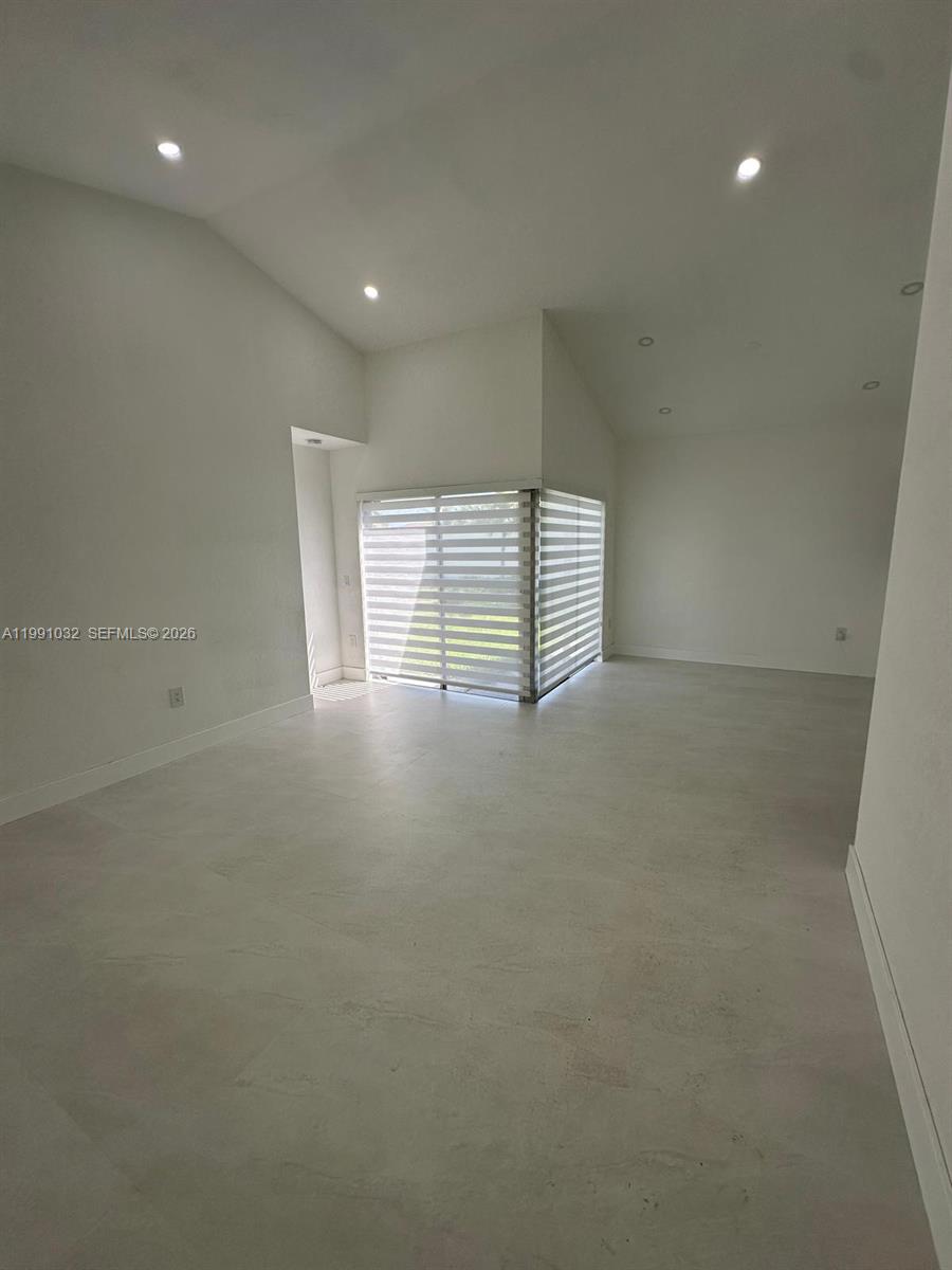 20926 Southwest 124th Ave Road Miami, FL 33177 - Photo 8 of 10 a view of an empty room with a window