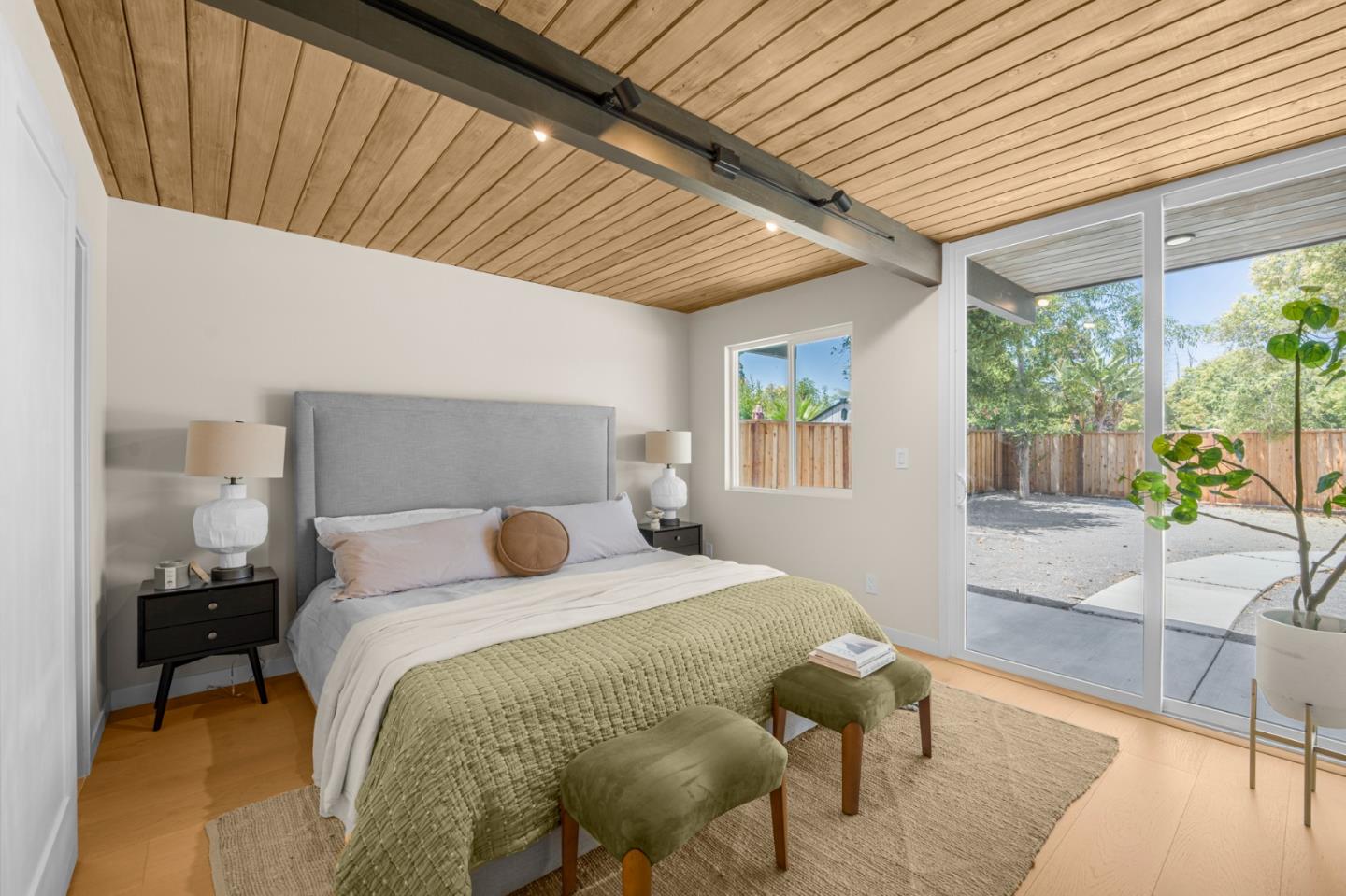 1111 East Homestead Road Sunnyvale, CA 94087 - Photo 14 of 25 a bedroom with a bed and wooden floor