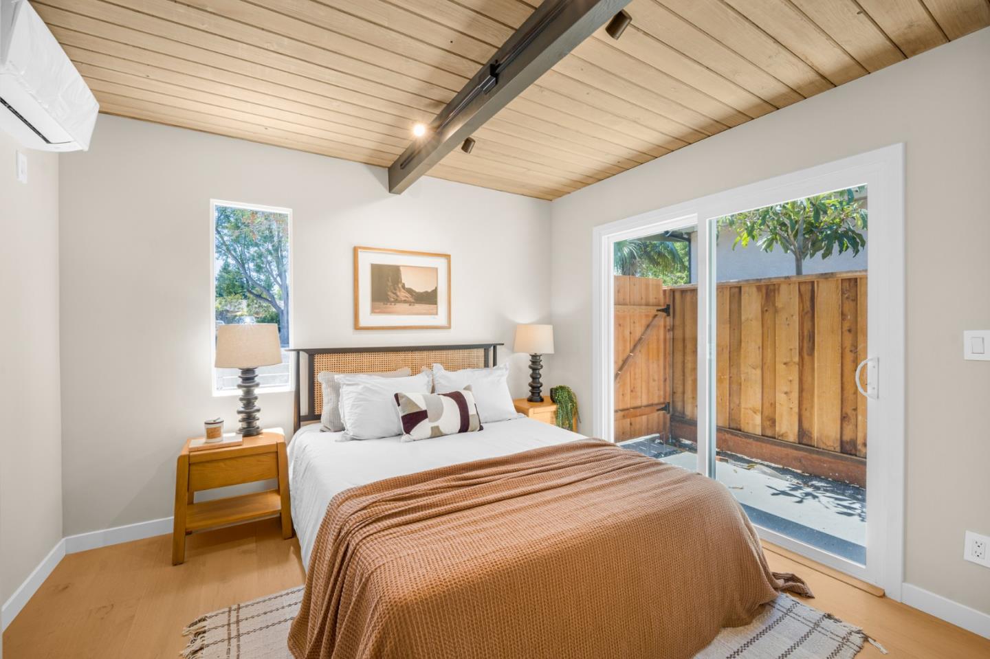 1111 East Homestead Road Sunnyvale, CA 94087 - Photo 15 of 25 a bedroom with a bed and a large window with outer view