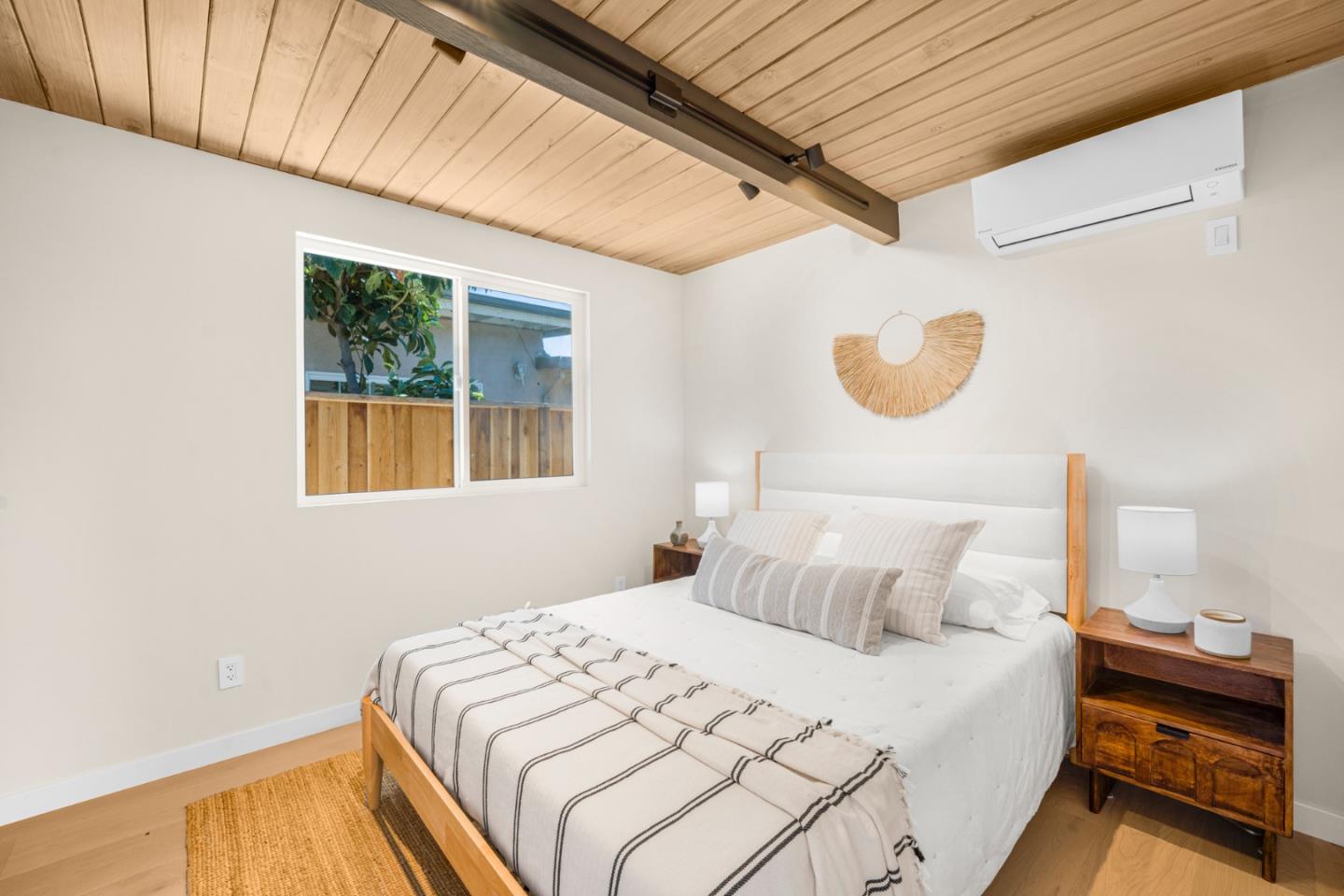 1111 East Homestead Road Sunnyvale, CA 94087 - Photo 16 of 25 a bedroom with a bed and a window