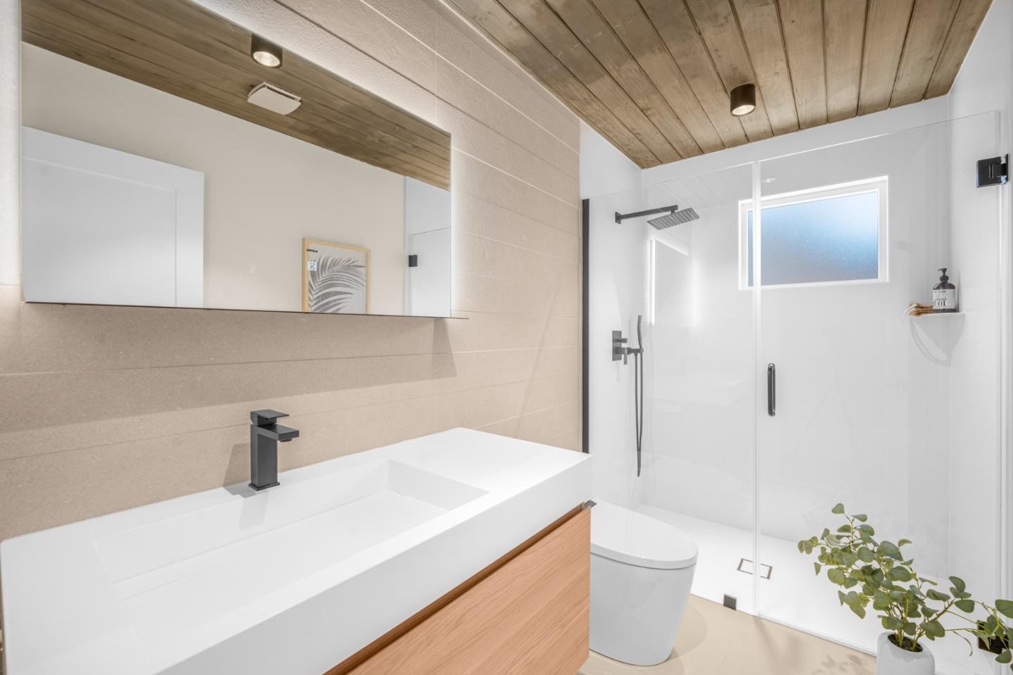 1111 East Homestead Road Sunnyvale, CA 94087 - Photo 18 of 25 a bathroom with a sink a toilet and shower