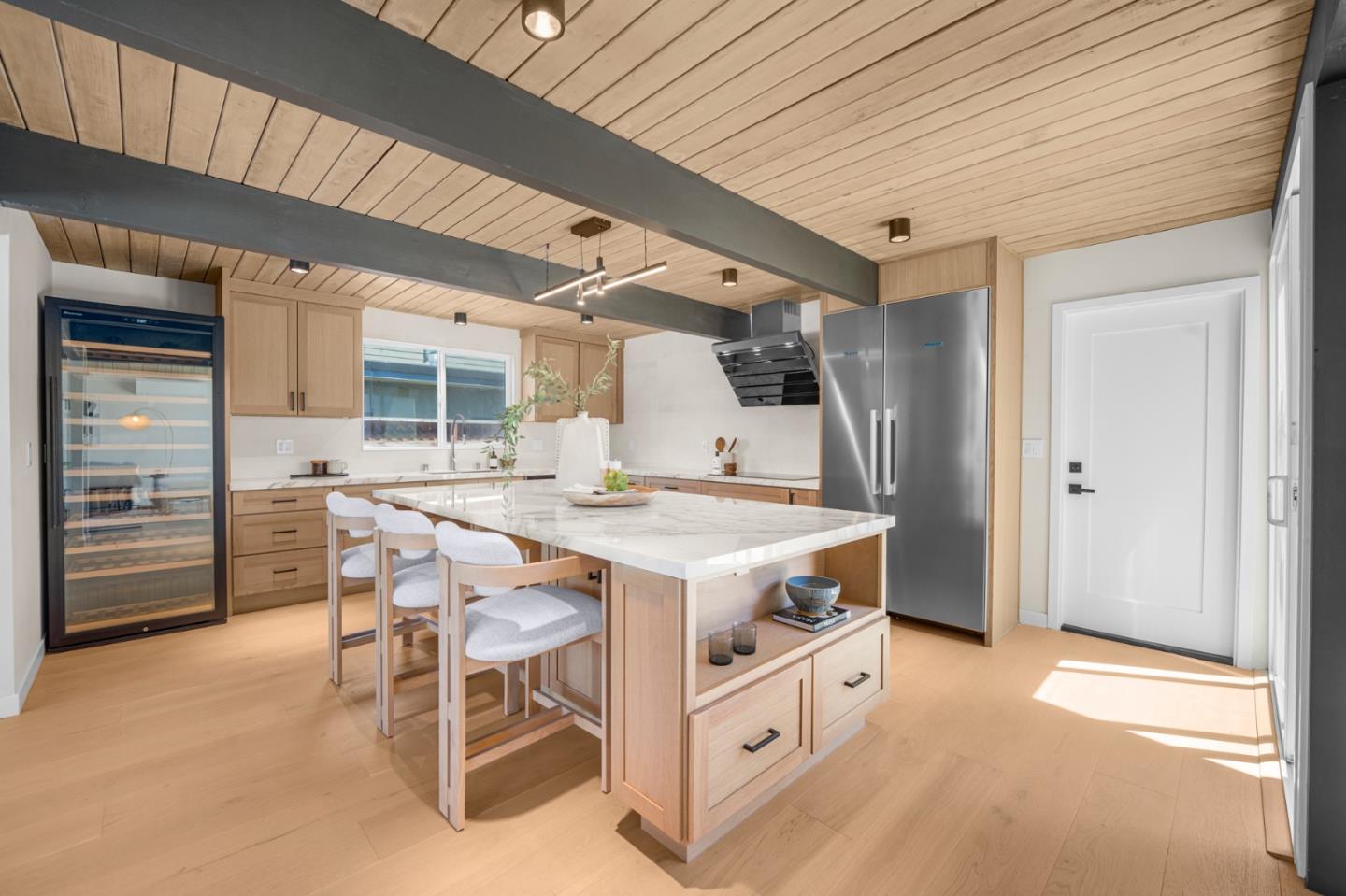 1111 East Homestead Road Sunnyvale, CA 94087 - Photo 2 of 25 a kitchen with a stove a table and chairs
