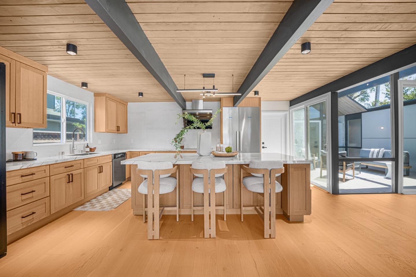 1111 East Homestead Road Sunnyvale, CA 94087 - Photo 3 of 25 a large kitchen with a table and chairs