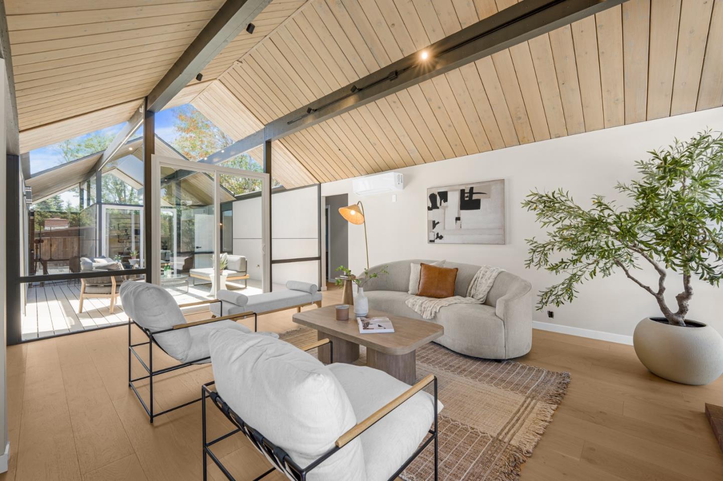 1111 East Homestead Road Sunnyvale, CA 94087 - Photo 7 of 25 a building outdoor space with patio furniture and potted plants