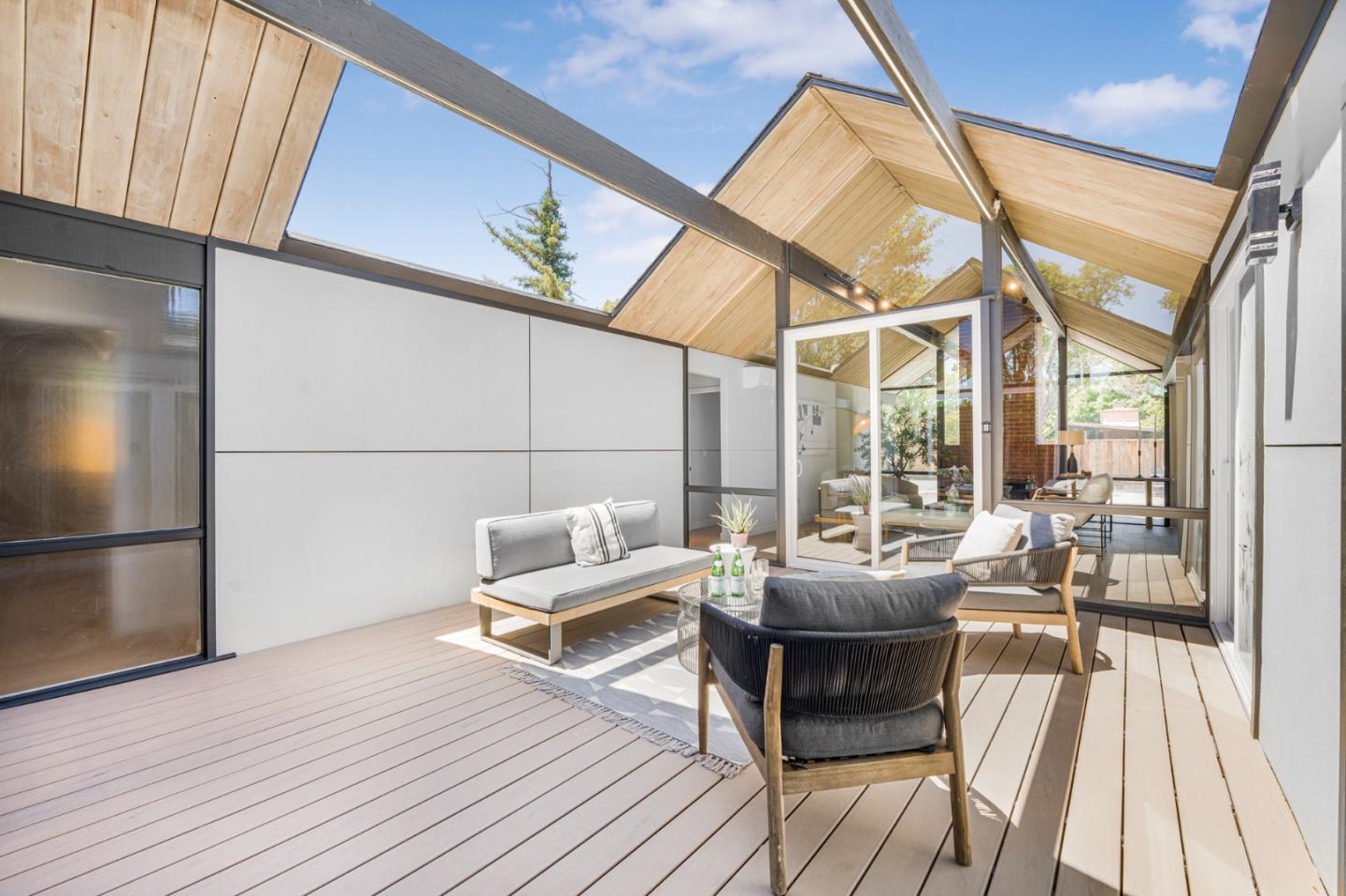 1111 East Homestead Road Sunnyvale, CA 94087 - Photo 9 of 25 a living room with furniture and a fireplace