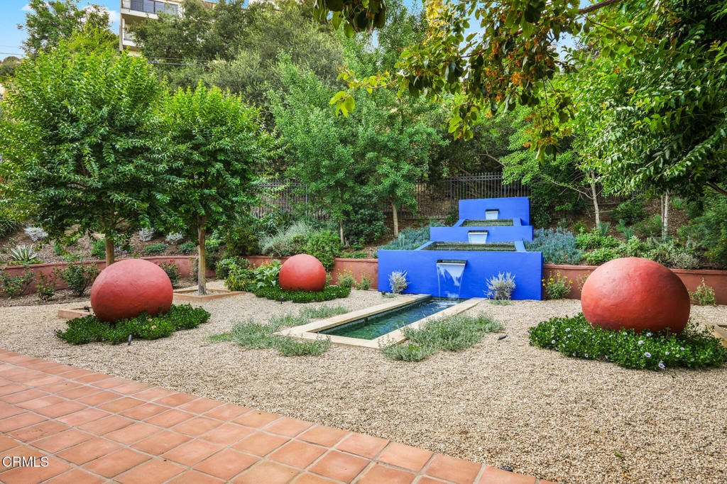 a view of a backyard with table and chairs