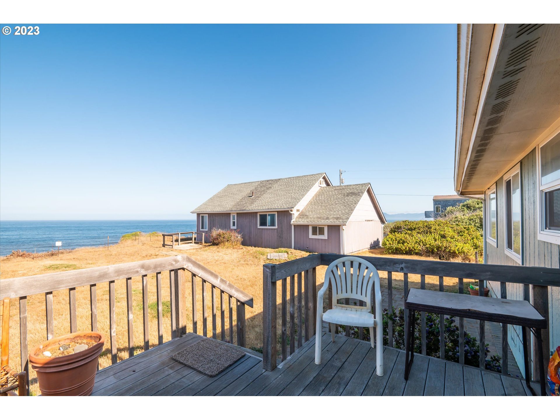 33032 Nesika Road Gold Beach, OR 97444 - Photo 15 of 35 a view of a patio with wooden floor