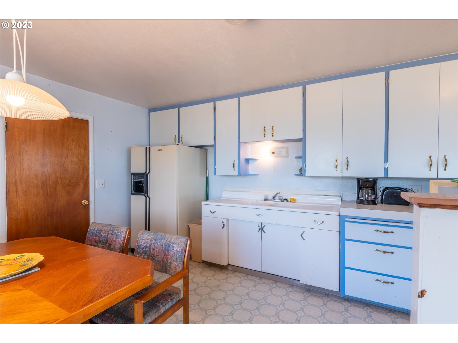 33032 Nesika Road Gold Beach, OR 97444 - Photo 20 of 35 a kitchen with stainless steel appliances granite countertop a refrigerator sink and cabinets