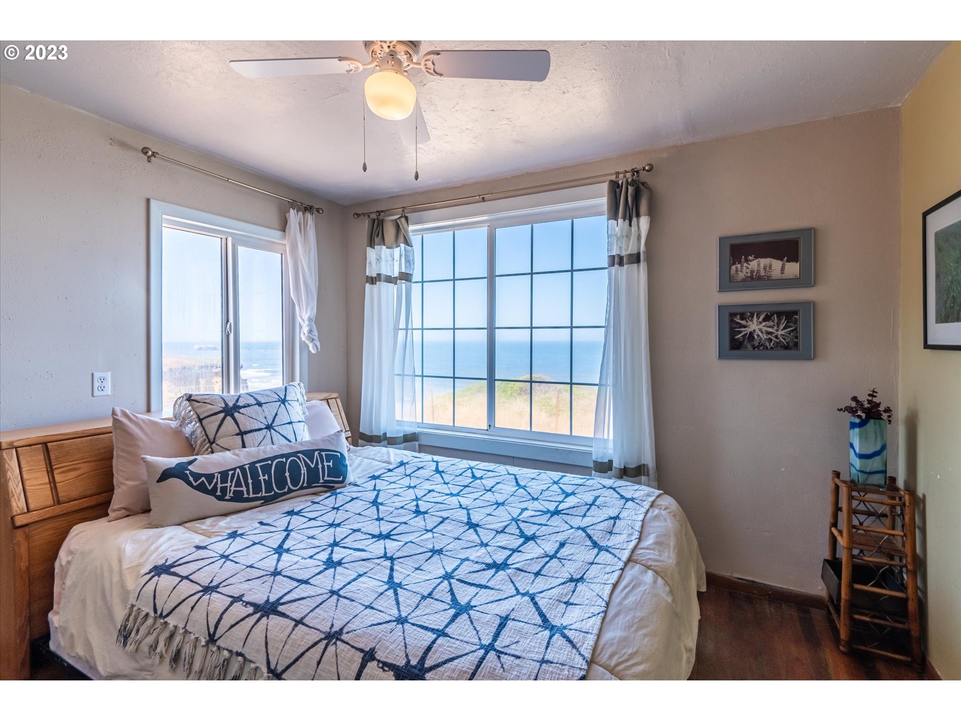 33032 Nesika Road Gold Beach, OR 97444 - Photo 22 of 35 a bedroom with a bed and a window