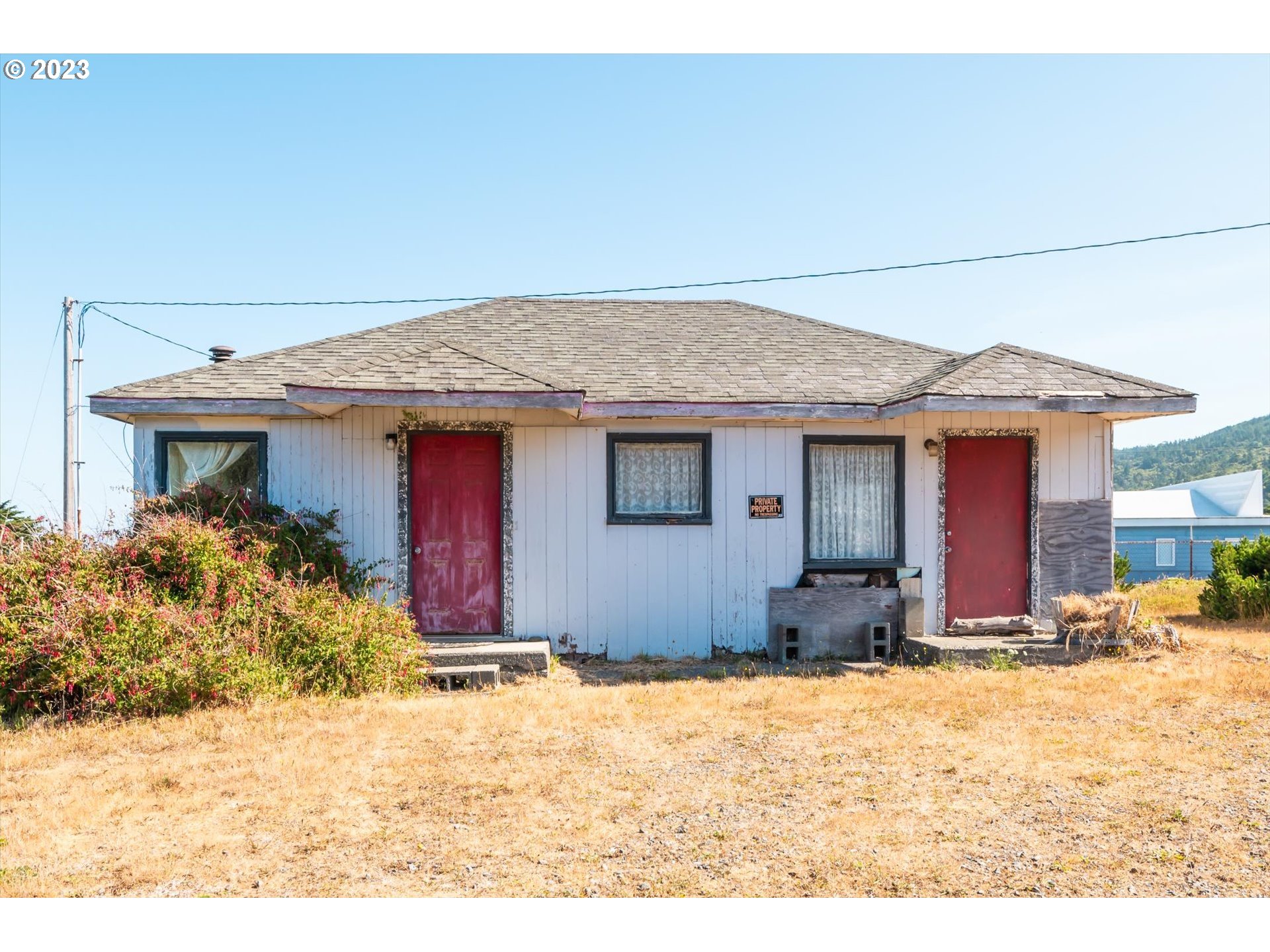 33032 Nesika Road Gold Beach, OR 97444 - Photo 28 of 35 a view of a house with snow on the road