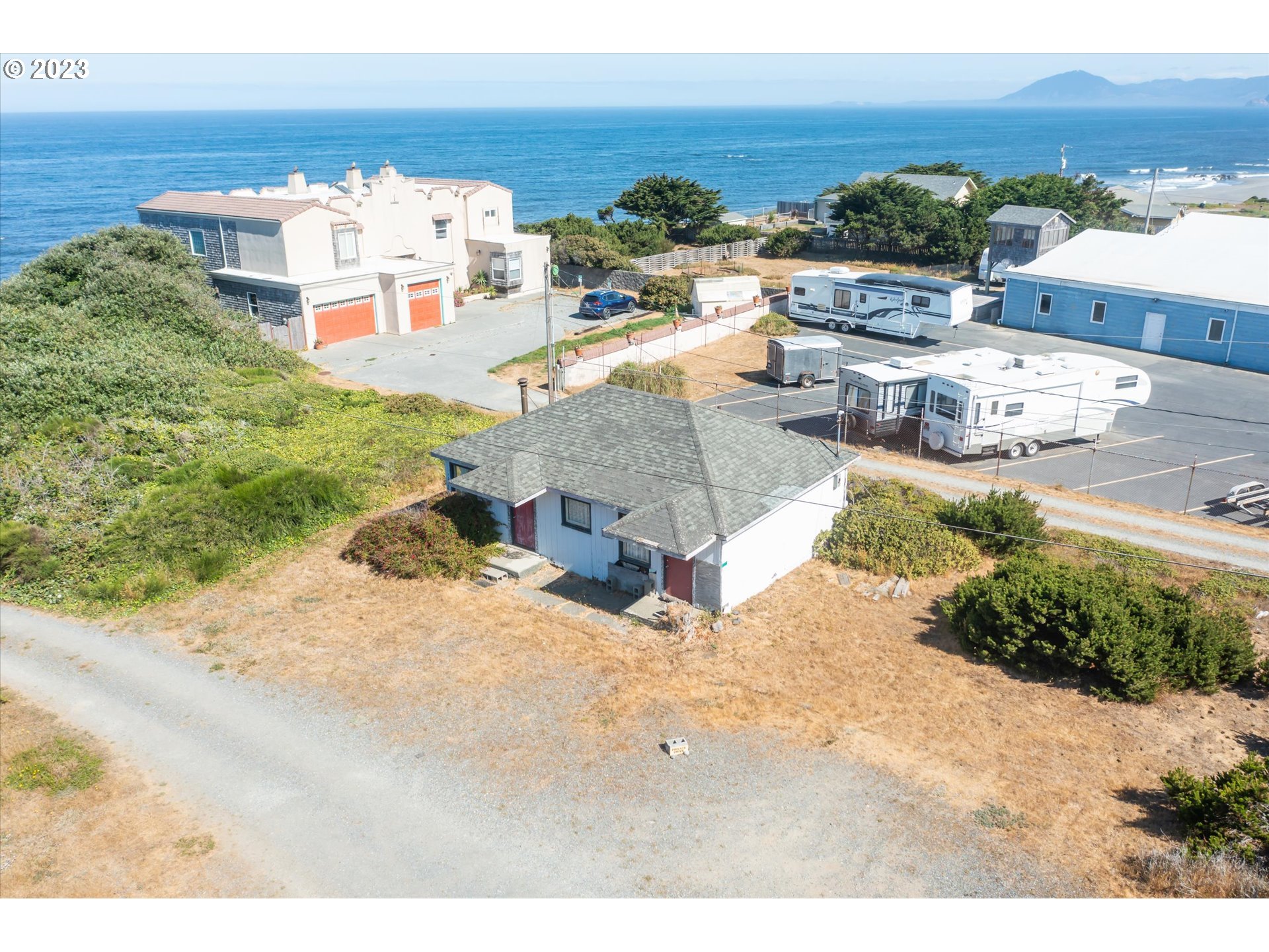 33032 Nesika Road Gold Beach, OR 97444 - Photo 29 of 35 a view of a terrace with lawn chairs