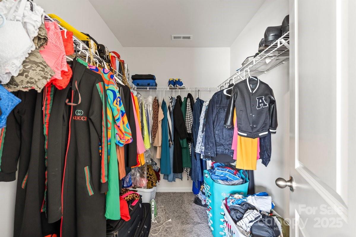 1317 Mifflin Lane Dallas, NC 28034 - Photo 17 of 19 a view of walk in closet with clothes