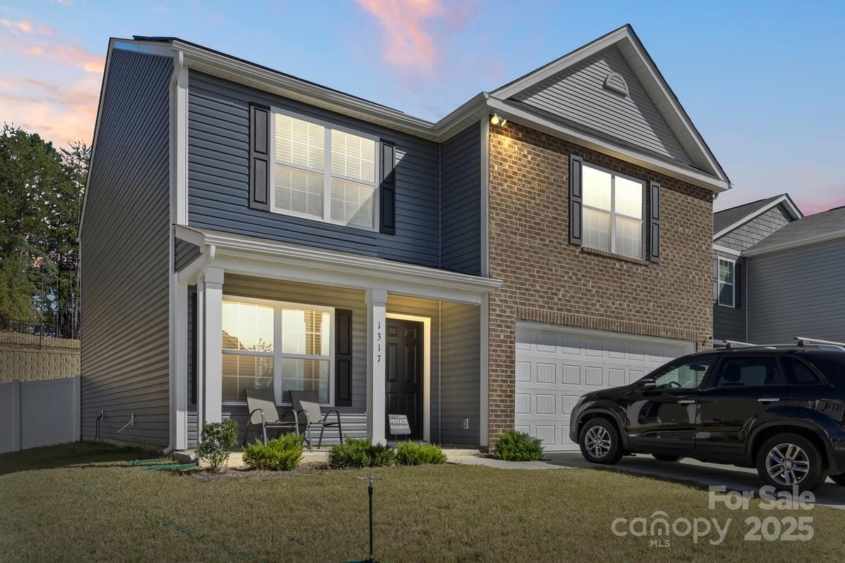 1317 Mifflin Lane Dallas, NC 28034 - Photo 3 of 19 a car parked in front of a house