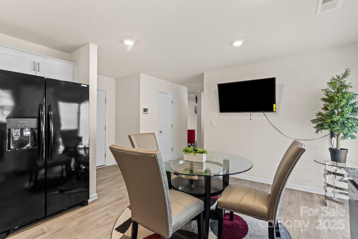 1317 Mifflin Lane Dallas, NC 28034 - Photo 7 of 19 a view of a dining room with furniture and wooden floor