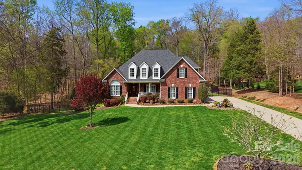 a view of a house with a big yard