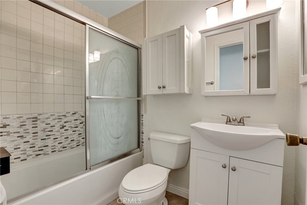 21822 Jinetes Mission Viejo, CA 92691 - Photo 11 of 33 a bathroom with a sink a toilet and shower