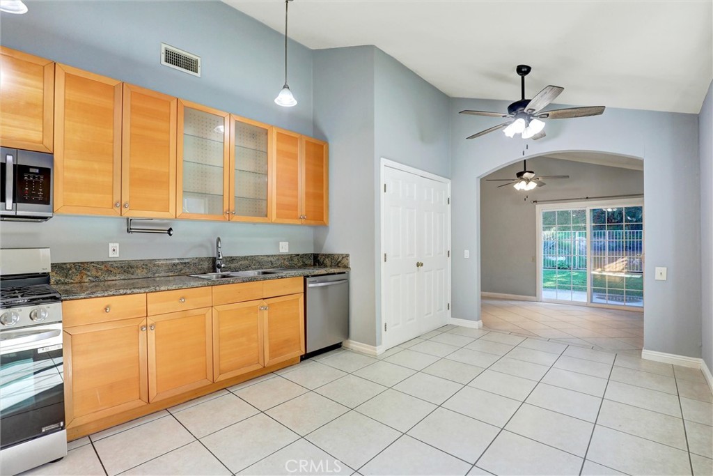 21822 Jinetes Mission Viejo, CA 92691 - Photo 23 of 33 a kitchen with granite countertop a sink and cabinets