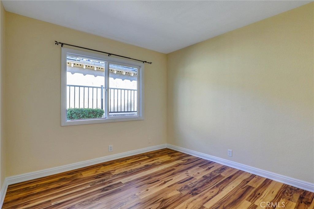21822 Jinetes Mission Viejo, CA 92691 - Photo 8 of 33 a view of a room with wooden floor and windows