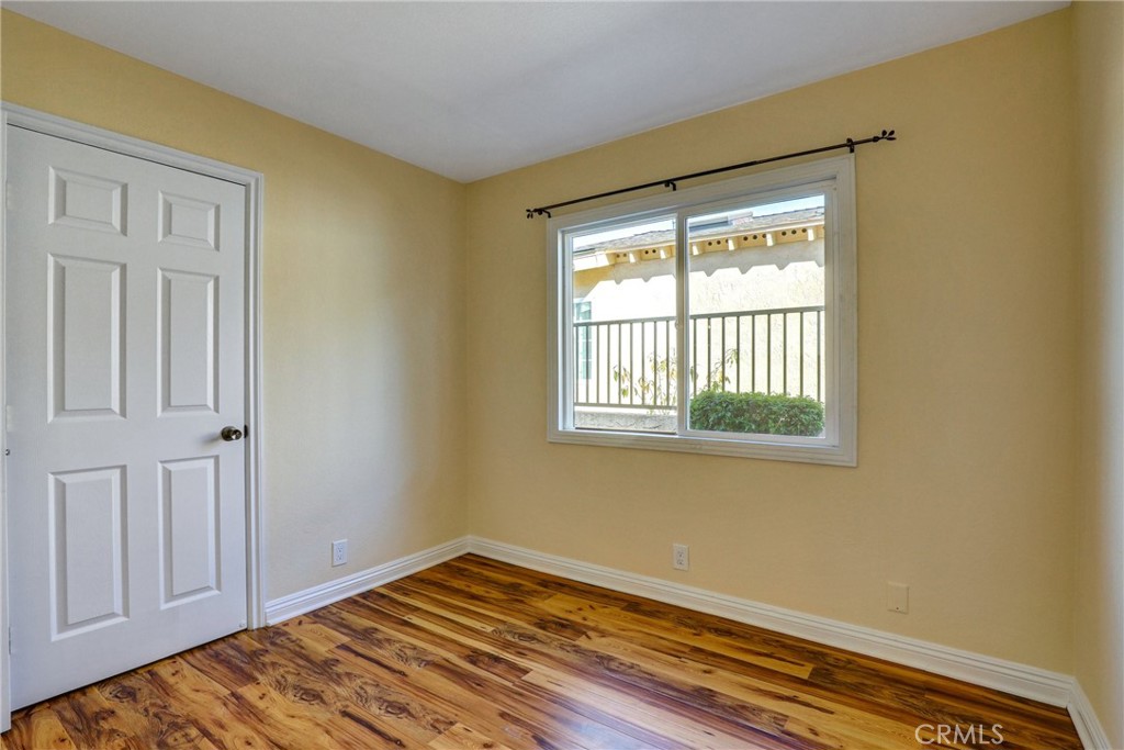 21822 Jinetes Mission Viejo, CA 92691 - Photo 9 of 33 a view of empty room with wooden floor and fan