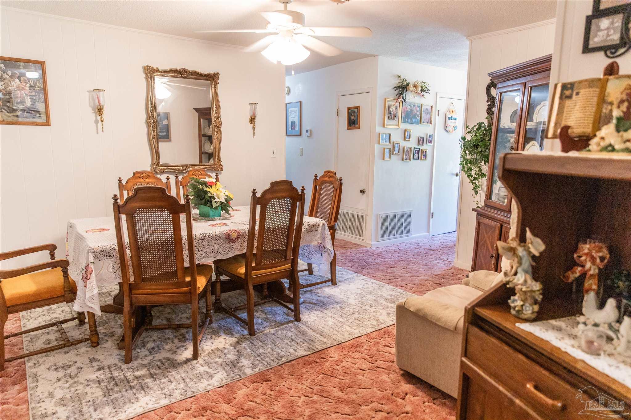 7569 Pine Meadows Loop Milton, FL 32571 - Photo 18 of 25 a view of a livingroom and dining room