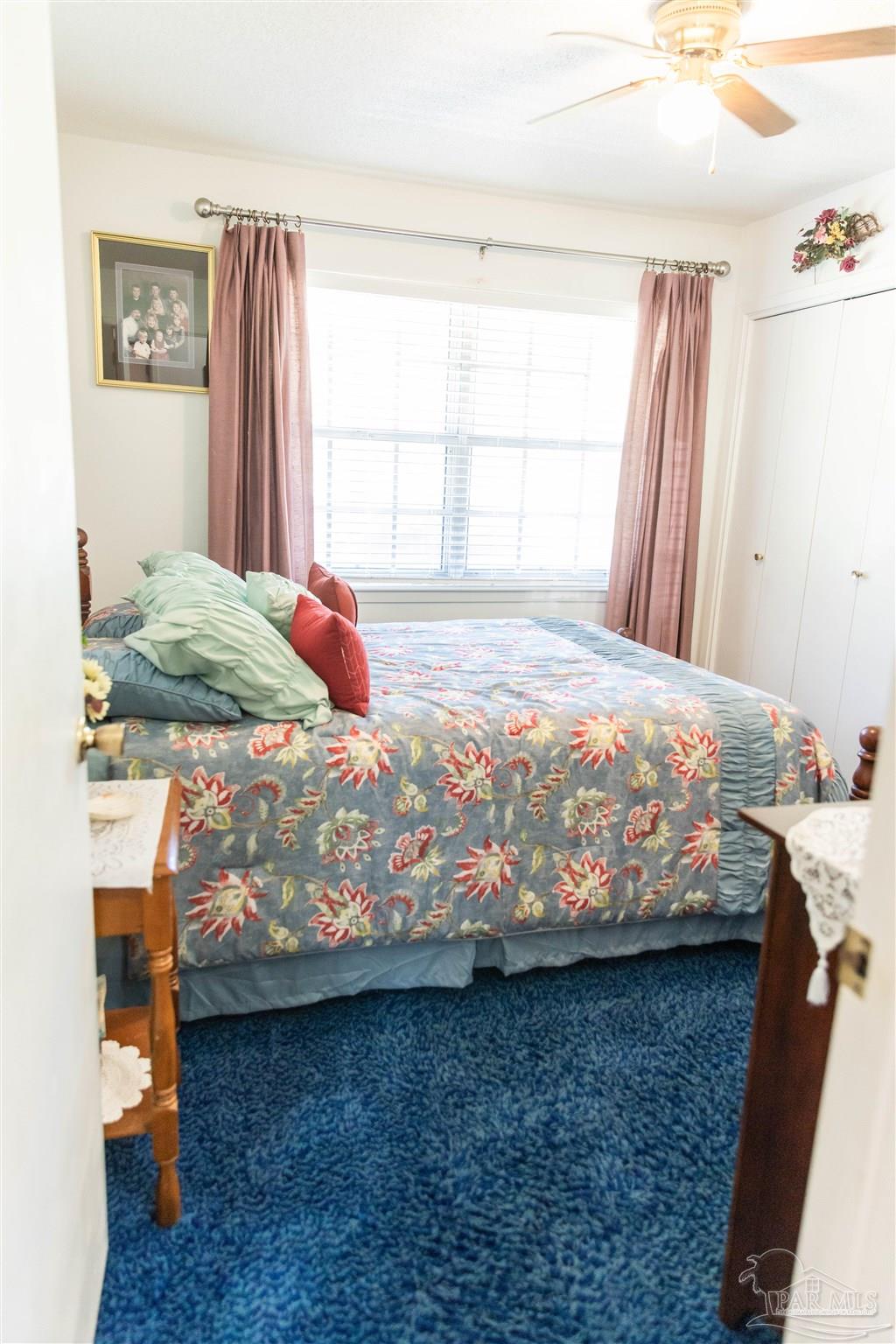 7569 Pine Meadows Loop Milton, FL 32571 - Photo 22 of 25 a bedroom with a bed and a window