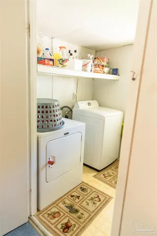 a utility room with washer and dryer