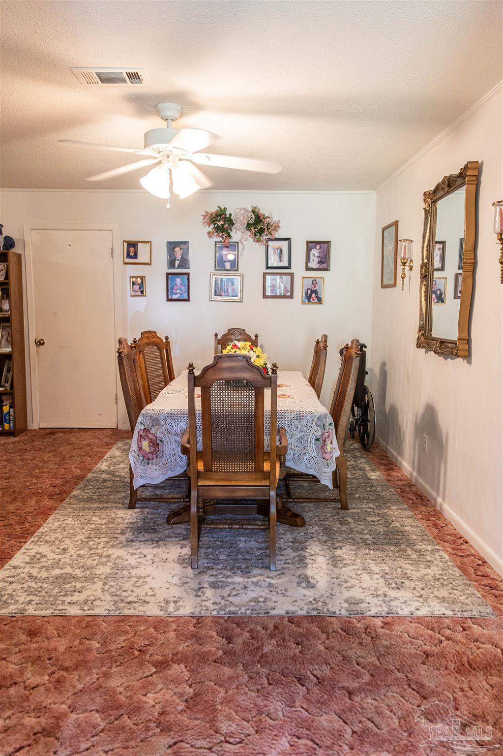 7569 Pine Meadows Loop Milton, FL 32571 - Photo 10 of 25 a living room with furniture and a window