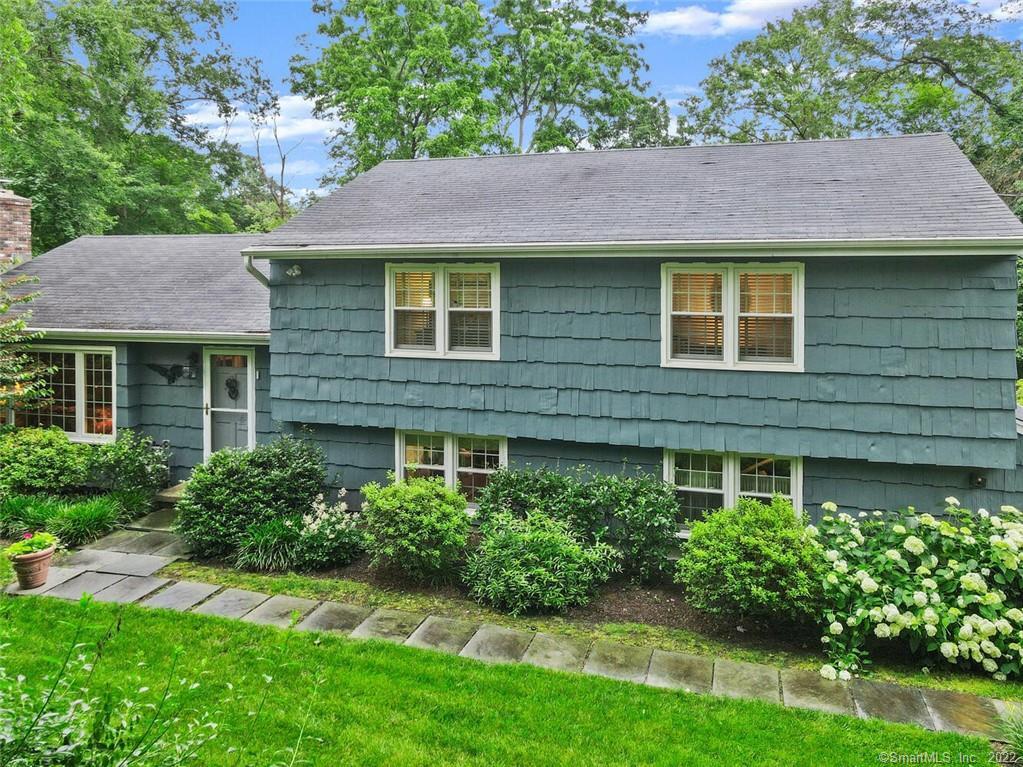 19 Redmont Road Stamford, CT 06903 - Photo 1 of 1 a view of a house with a yard and a garden