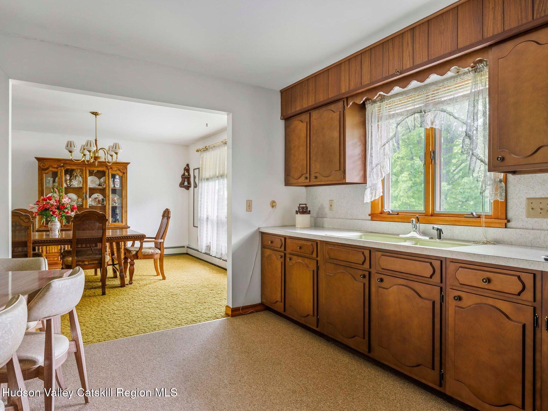104 New Paltz Road Highland, NY 12528 - Photo 5 of 43 a spacious bathroom with a double vanity sink and a mirror