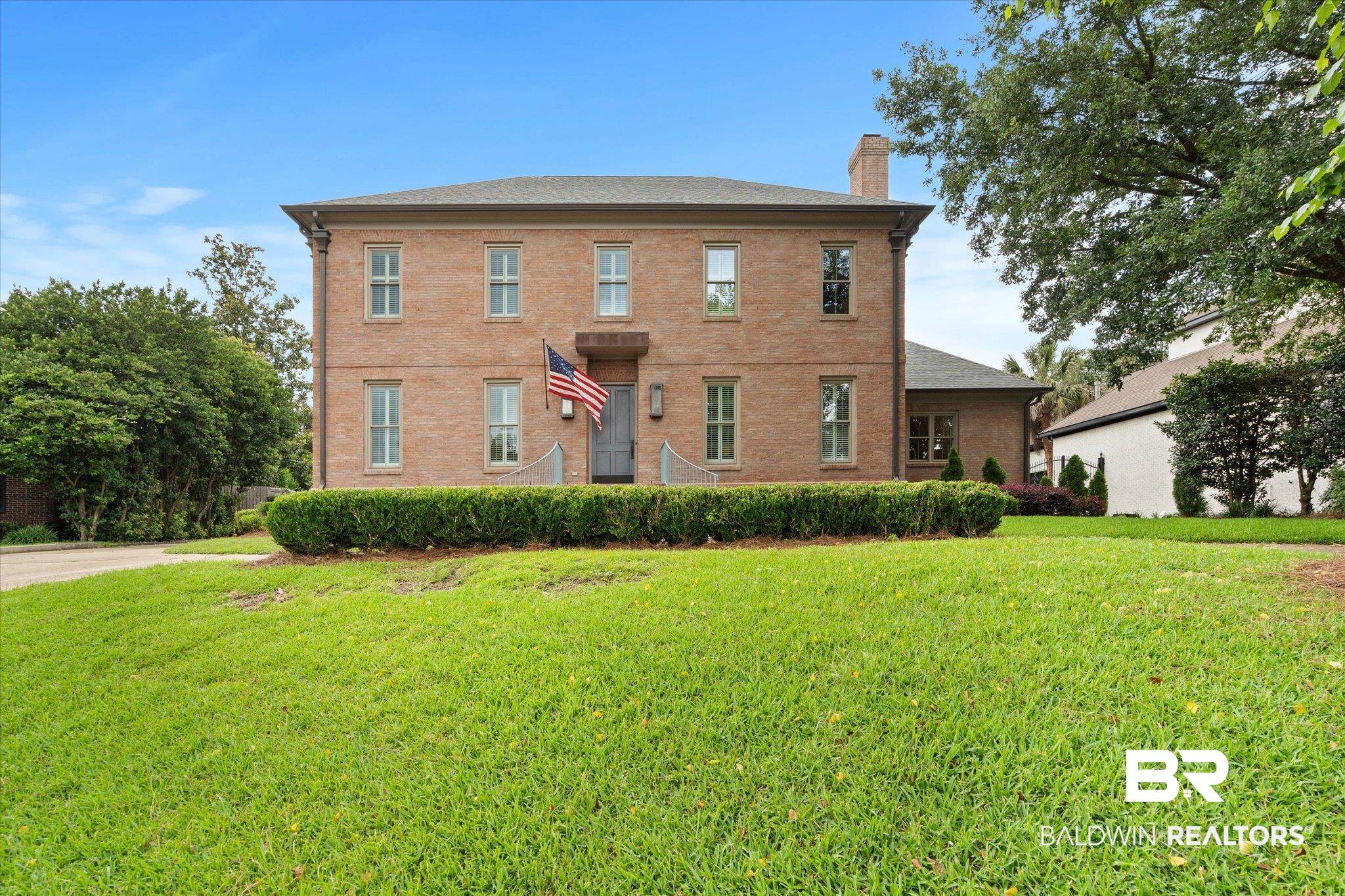 4008 McGregor Oaks Mobile, AL 36608 - Photo 48 of 50 View of front of house featuring a chimney, a front lawn, and brick siding