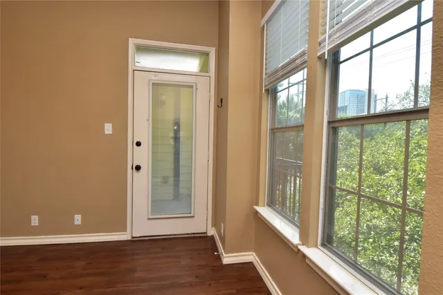 a bathroom with a granite countertop shower and a sink