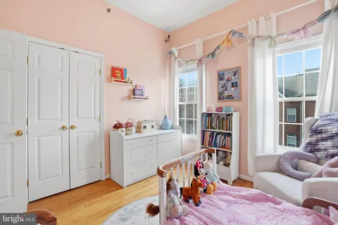 a view of a livingroom with workspace and a window