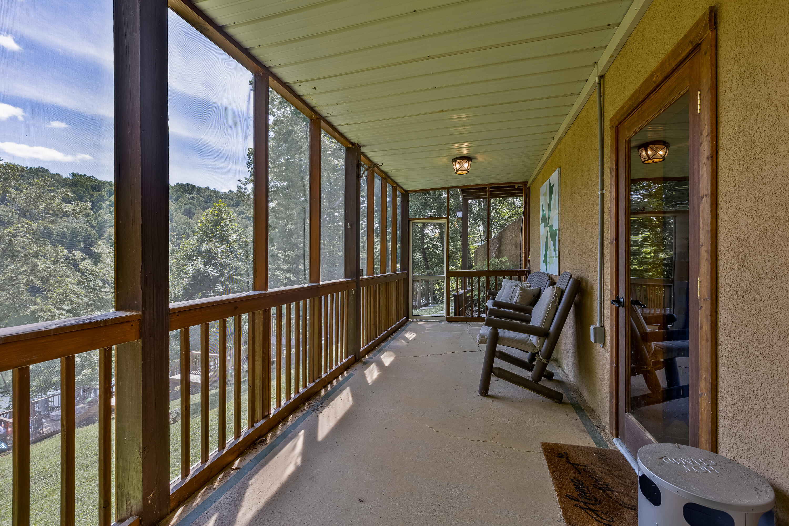 737 Cliffs Edge Road East Bernstadt, KY 40729 - Photo 26 of 39 Screened in patio off the basement.