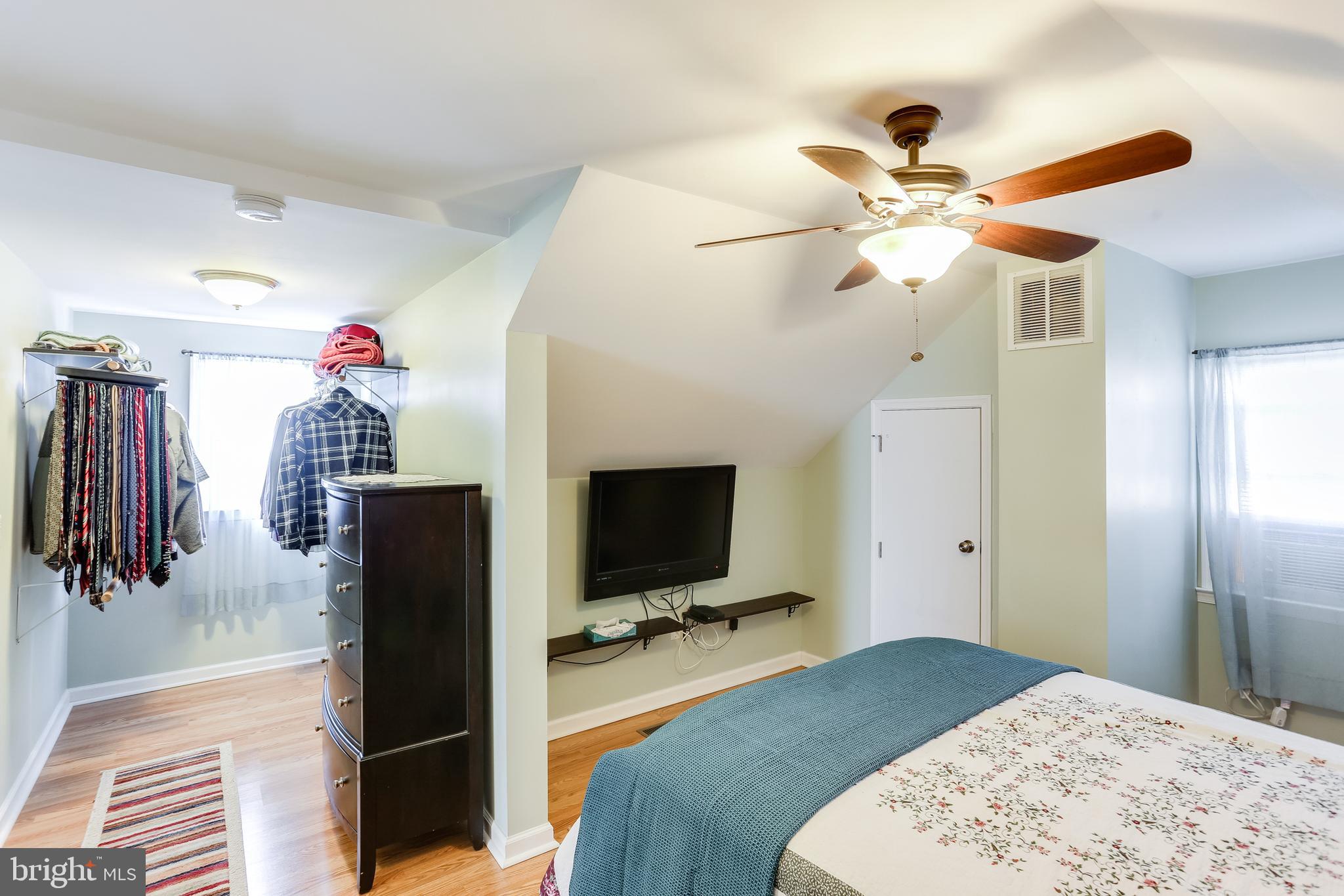 1809 Briarcliff Road Baltimore, MD 21234 - Photo 19 of 33 a bedroom with a bed and a flat screen tv