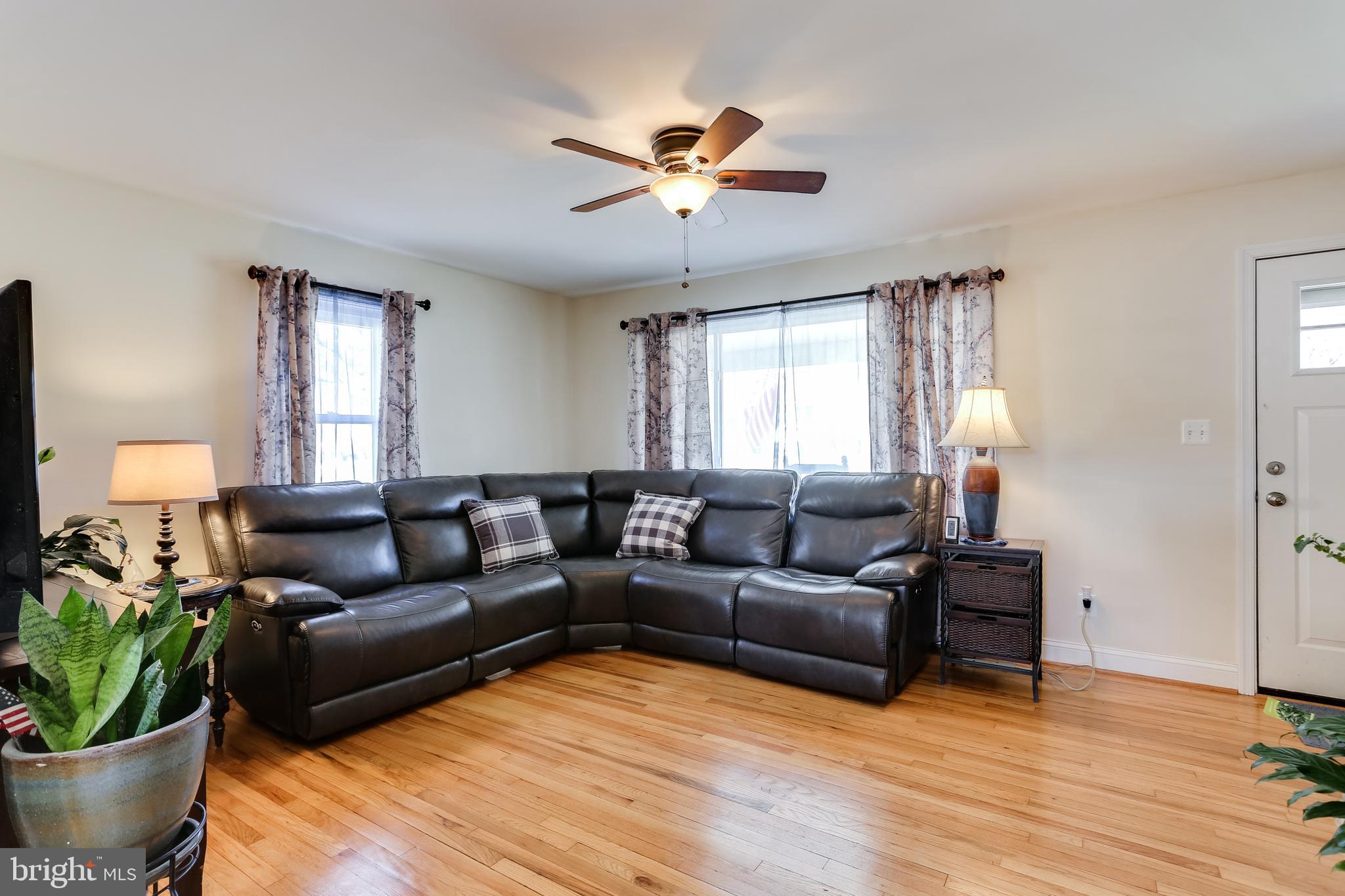 1809 Briarcliff Road Baltimore, MD 21234 - Photo 3 of 33 a living room with furniture and a potted plant
